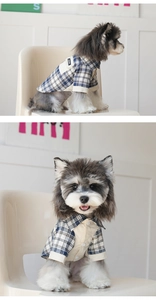 Detail of navy blue plaid pet shirt featuring a turn-down collar and button closure
