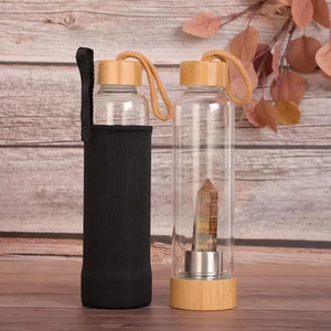 Bamboo lid glass water bottle with natural tiger eye crystal point and black protective sleeve