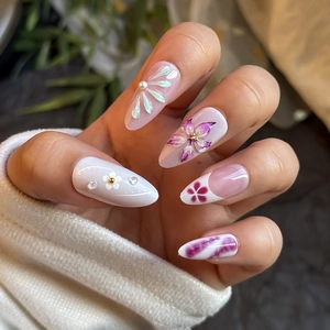 French almond press-on nails with 3D floral carving and pearls on almond shape tips
