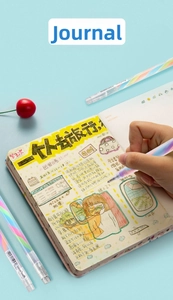Rainbow gradient highlighter pen drawing colorful patterns on a creative journal