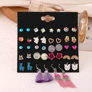 Detailed set of cartoon stud earrings with unicorn and panda motifs on black card