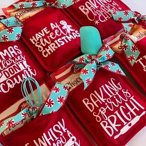 Christmas baking gift set with pot holder, whisk, and cookie mix in festive red and blue