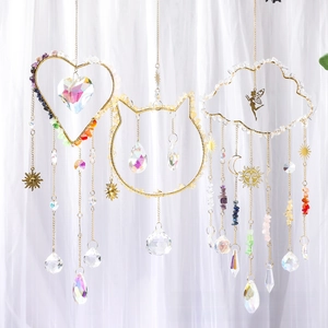 Detailed view of cloud, cat and heart crystal suncatchers with K9 faceted glass prisms