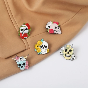 Skull and rose enamel pins set on a tan suit jacket, gothic horror style badges