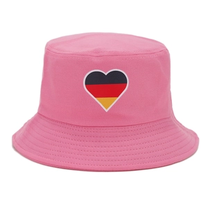Close-up of pink canvas bucket hat featuring a heart-shaped German flag patch embroidery