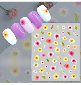 Detail of floral daisy nail stickers in yellow and pink with 3D adhesive texture