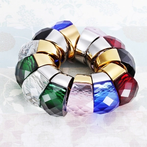 Macro shot of colorful faceted crystal magnetic clips in gold and silver metal settings