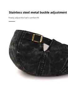 Detail of adjustable stainless steel buckle on vintage washed denim beret cap
