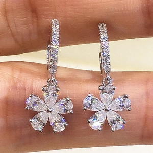 Elegant silver five-petal flower drop earrings with sparkling marquise-cut gemstones