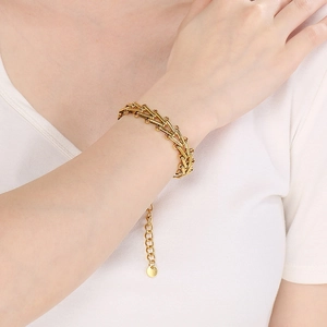 Elegant 18K gold-plated bamboo joint chain bracelet on female model wrist with adjustable clasp