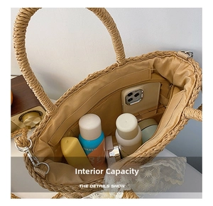 Interior view of straw woven tote bag showing beige lining and large storage capacity