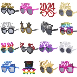 Set of 16 colorful Happy New Year 2024 party glasses with glitter and festive shapes