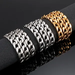 Flat Cuban link chains in gold, silver, and rose gold displayed on a black podium