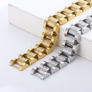 Macro detail of gold and silver stainless steel watch-link bracelets with CNC CZ inlay