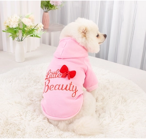 Pink dog hoodie featuring Little Beauty text and a red polka dot bow on the back