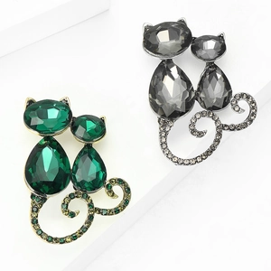 Fashionable cat brooches with faceted crystals and rhinestones in gold and silver finish