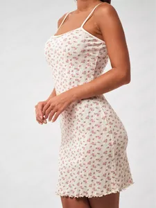 Detailed view of floral mini dress showing delicate lace trim and ribbed knit texture