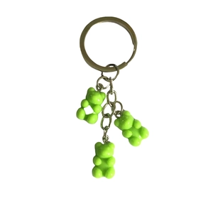 Creative keychain featuring three green resin bear pendants on a silver metal ring