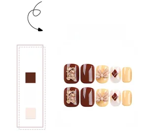 Detailed view of press-on nails featuring 3D brown bears and yellow bows decorations