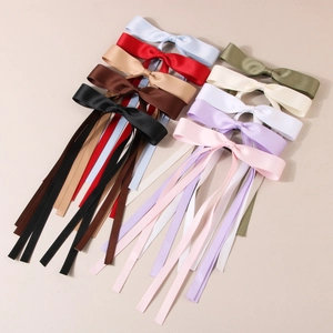 Elegant satin ribbon bow hair clips in multiple colors including red, black and beige