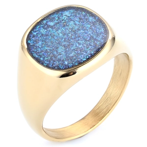 Golden signet ring with oval blue sandstone inlay on a clean minimalist white background