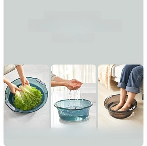 Three-piece set of thick translucent grey plastic basins for washing and foot baths