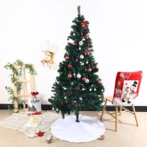 Christmas decoration set with green tree, white plush skirt and red festive chair covers