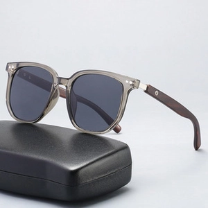Men's grey transparent sunglasses with wood grain temples and black hard leather case