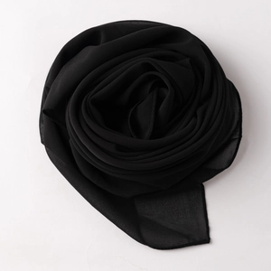 Close-up of lightweight solid black chiffon headscarf showing soft texture and draping