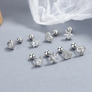 Detailed set of 925 silver heart and star screw back studs with white cubic zirconia