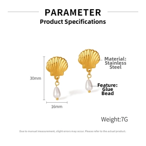 Detail view of gold shell earrings with white drop pearls and precise 30mm height measure