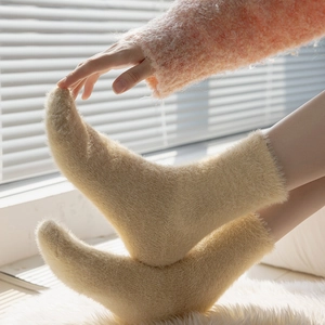 Thick beige mink velvet thermal floor socks for women in a cozy home setting