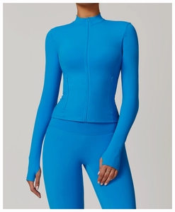 Detail showing the functional thumbholes on sleeves of a blue zipper yoga jacket