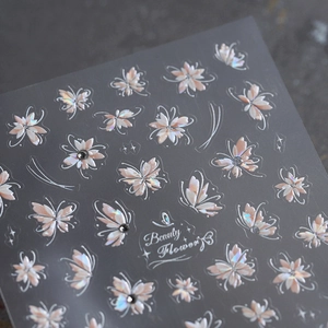 Holographic butterfly and flower nail stickers with black rhinestones and Beauty Flower text
