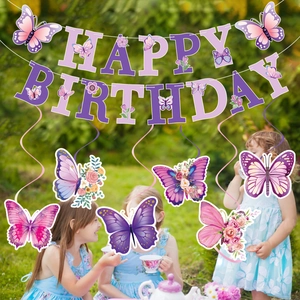 Purple butterfly birthday banner and spiral decorations for a girls outdoor tea party