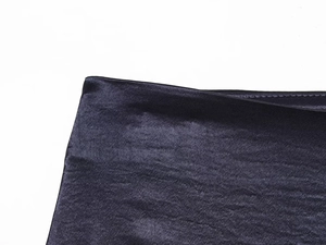 Close-up of the smooth dark blue satin fabric texture for this lace mini dress