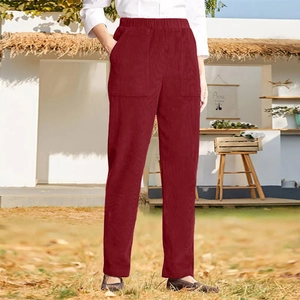 Detail of burgundy corduroy pants featuring an elastic high waist and side pockets