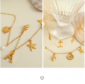 Detailed close-up of 18K gold-plated necklace with starfish shell and letter pendants