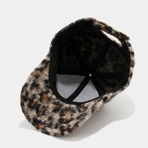 Detailed interior of plush leopard baseball cap showing structure and inner lining