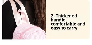 Detail of the thickened handle on a pink seersucker backpack for comfortable carrying