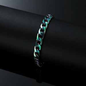 Rainbow stainless steel Cuban chain bracelet on black leather display with reflection