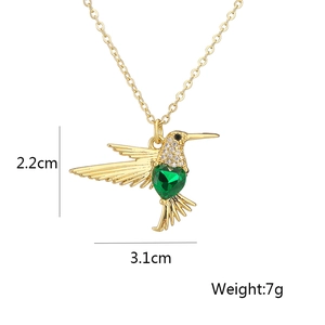 Detailed size chart of hummingbird pendant featuring green heart stone and 18K gold plating