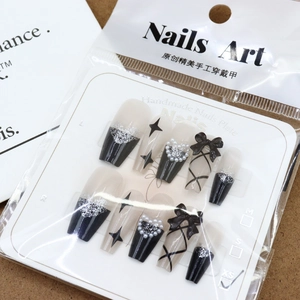 Black press-on nails with 3D bows and heart pearls in medium coffin shape