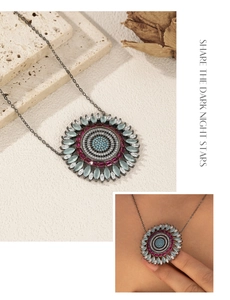 Macro detail of S925 silver sunflower pendant necklace with multi-colored crystals
