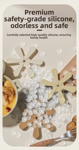 Petal-shaped silicone coasters in beige and brown colors on a modern kitchen counter