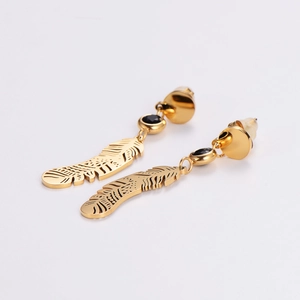 Elegant gold feather earrings with black gemstone inlay on a white background