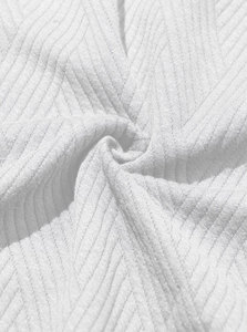 Detailed macro view of white ribbed knit fabric texture for men's sleeveless hoodie set