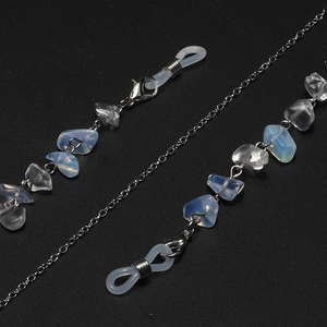 Detailed view of silver metal chain with opal stones and white silicone anti-slip loops