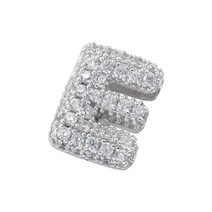Macro view of silver bubble letter E pendant with brilliant white 5A zircon inlay
