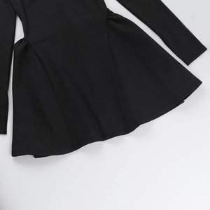 Close-up of the fine fabric texture and stitching on this black long sleeve dress